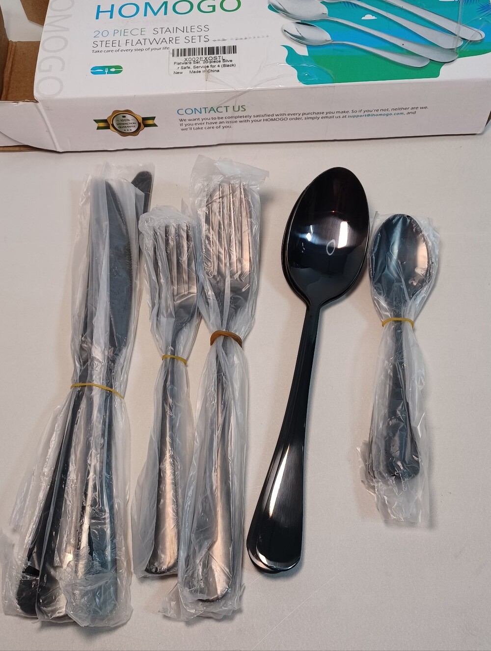 Black 20-Piece Stainless Steel Flatware Set - Sleek Black Cutlery.